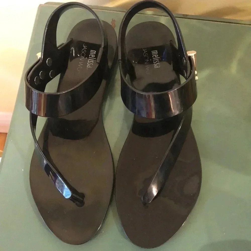 Melissa + Jason Wu sandals.